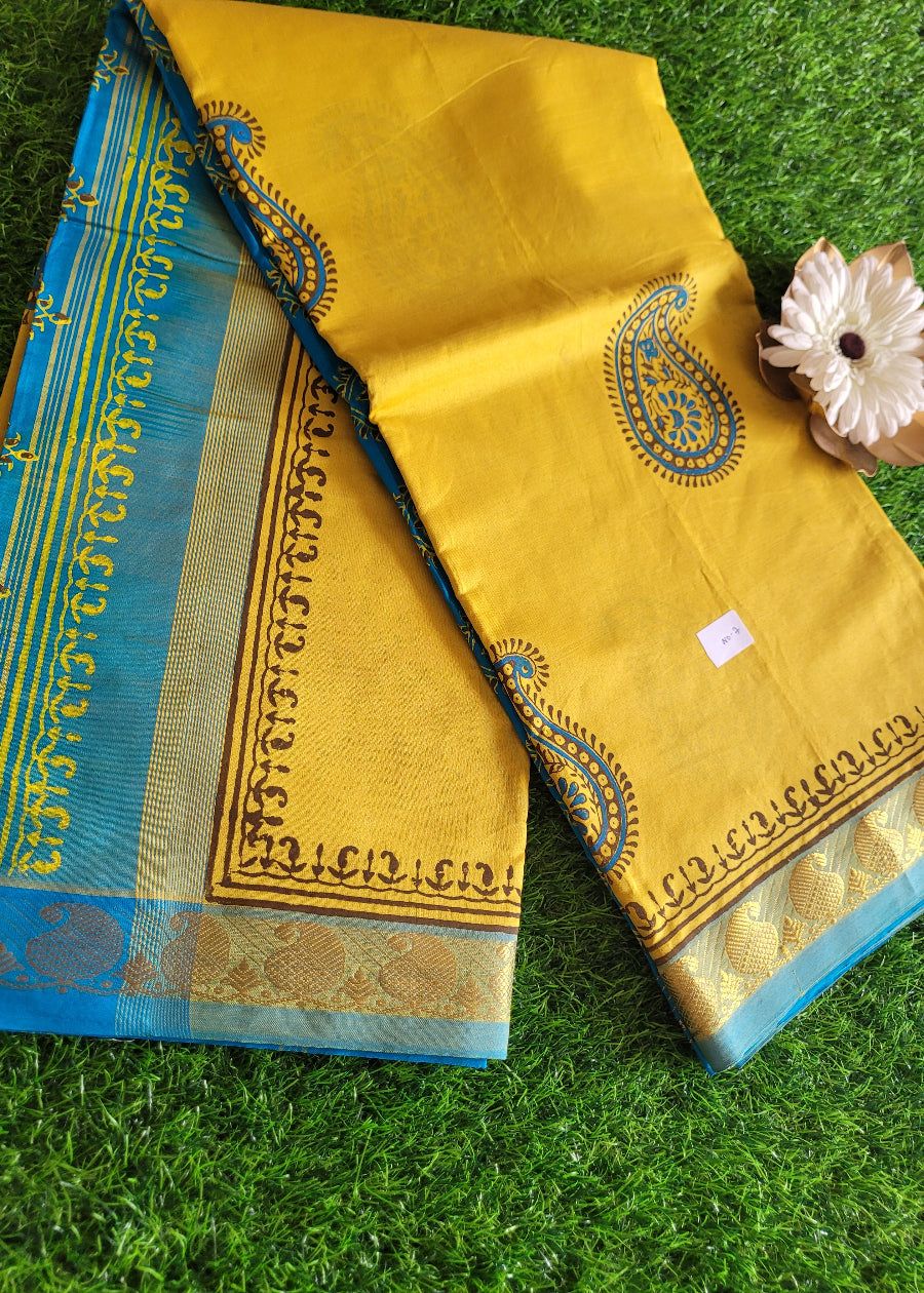 Yellow And Copper Sulphate Blue Printed Silk Cotton Saree- TN